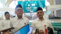Kepala BI Sulteng dan Asisten II Pemprov Sulteng launching SERAMBI 2026 Ramadhan-Idul Fitri terkait penukaran uang tunai Rp2,86 triliun di Sulawesi Tengah.